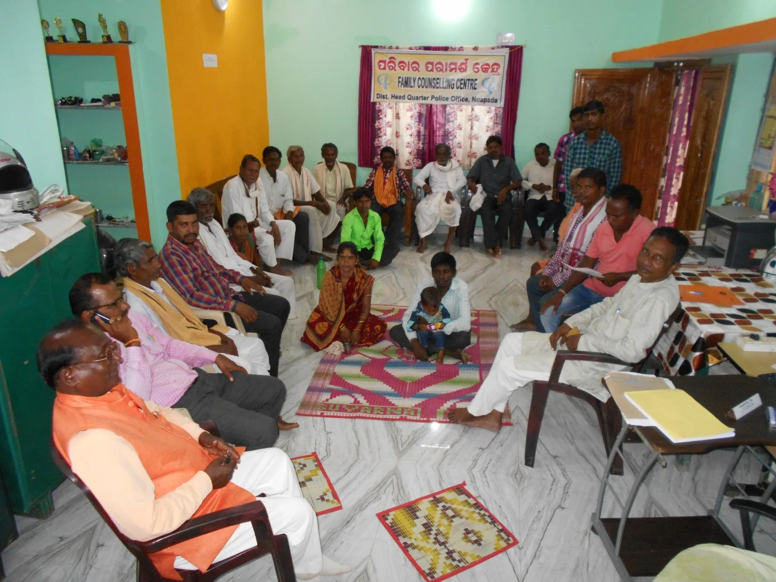 Community members seated together for a Family Counselling Centre meeting